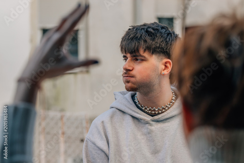Quadro su tela young man huffing and puffing, enduring the reprimand or argument