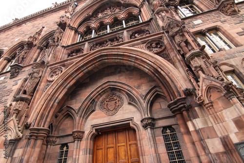 UK - Scotland - Edinburgh - The facade and the main entrance portal of Scottish National Portrait Gallery with rich decor and sculptures of historical figures at an artistic angle
