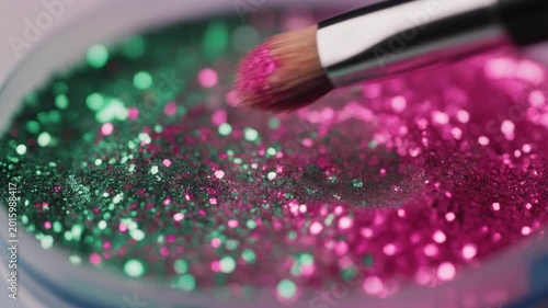 Makeup Artist Applying Vibrant Pink Glitter with Professional Eyeshadow Brush