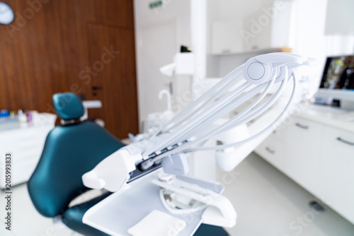 Canvas Print Dental delivery system arm with handpiece holders over chair