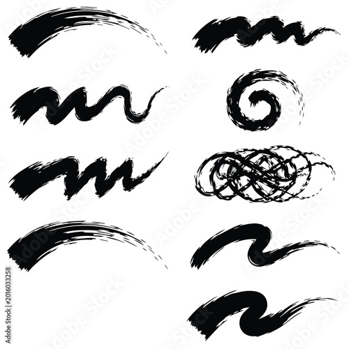 Set of black ink brush strokes, including wavy lines, spirals, and scribbles on a white background