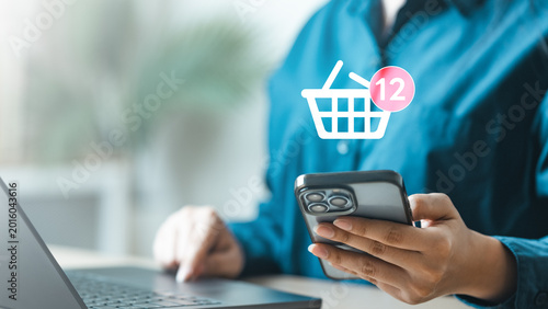 Cuadro en lienzo Mobile ecommerce wishlist and add to cart concept with smartphone shopping app, online store notifications and digital retail purchasing convenience