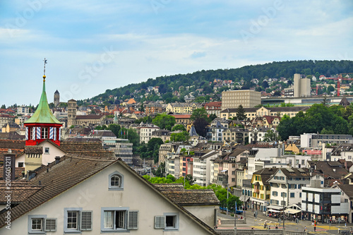 Skyline of Zurich Old Town with Zunfthaus zur Zimmerleuten and Zurichberg hill background