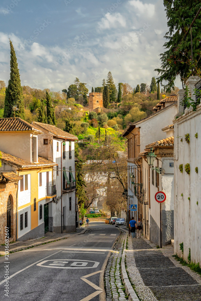 Fototapeta premium Granada, Spain. Historical streets of Spanish Granada. The Alhambra Palace complex. Beautiful Spanish city. Travel, Tourism 