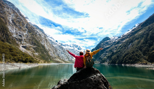 Tableau sur toile Travelers couple team look on the mountain landscape