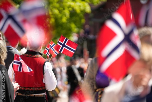 Norwegian Flags and Traditional Bunad Costumes Filling the Streets at Syttende Mai National Day Celebration