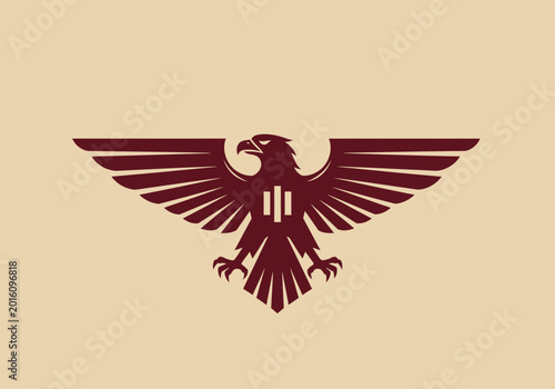 Stylized maroon eagle emblem with outstretched wings on cream background