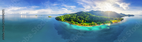 High angle aerial drone view of tropical island peninsula and coral reef lagoon