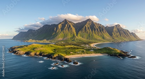 Aerial panoramic view of the Lofoten Islands coastline with jagged mountains green hills and sandy beaches under a sunset sky in Norway