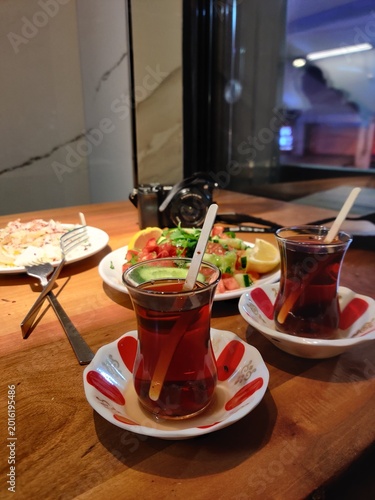 Authentic Turkish dining experience in Istanbul featuring grilled meat skewers, traditional Turkish tea, and rich local cuisine served in a cozy restaurant atmosphere.