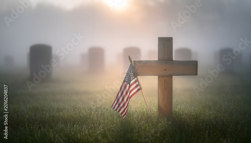American flag on wooden cross in misty cemetery - Memorial Day tribute