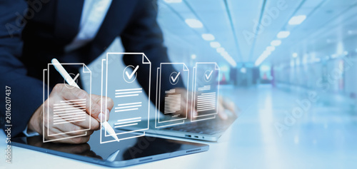 Slika na platnu Professional businessman signing digital documents with stylus on tablet