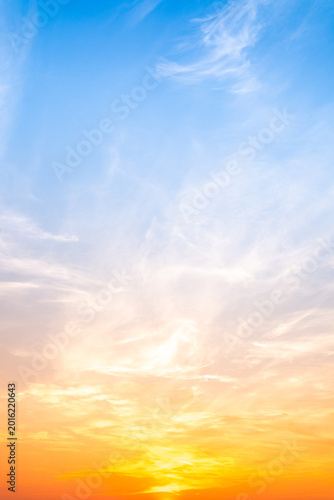 Картината върху платно Sky sunset,Beautiful sunrise sky with vibrant gradient orange and gold colors and soft blue, Clear atmosphere with wispy clouds