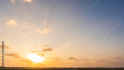 Morning Sunrise, Golden Sunset Sky with Orange sunlight in the Evening over hill, Landscape Horizon countryside colorful Sundown, Dusk sky Background