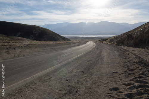 Scenic road leading through the desert landscape of Death Valley.