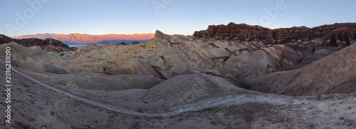 Silent pre-dawn landscape of Death Valley badlands.