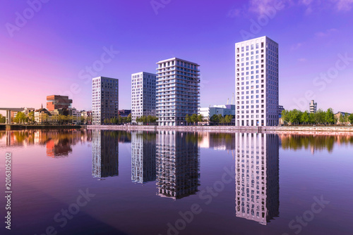 Buildings and perfect reflections in the water in the port of Antwerp