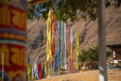 Konstfotografi Colorful Buddhist prayer flags fluttering in the wind against a rugged mountain