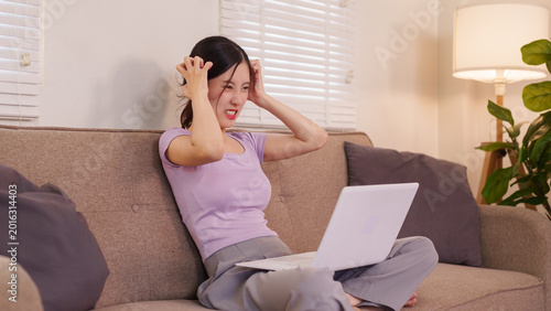 Cuadro en lienzo stressed Asian women feeling frustrated upset exhausted using laptop computer si