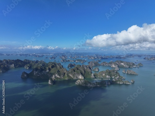 Aerial View of Karst Islands Rising from Turquoise Waters Under Clear Blue Sky
