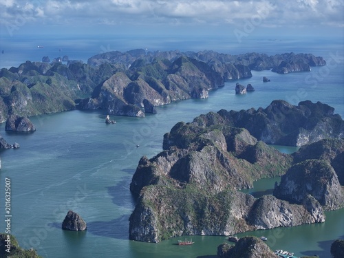 Aerial View of Karst Islands Rising from Turquoise Waters Under Clear Sky