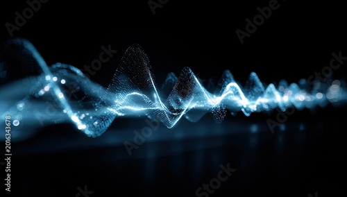 Glistening blue particles form a vibrant, energetic wave against black