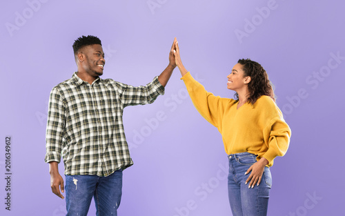 Tableau sur toile Two individuals are celebrating a fun moment together