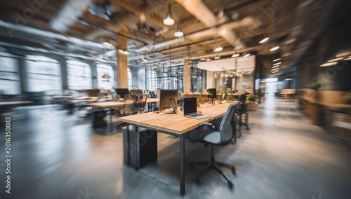 Modern Open Plan Office Space with Desks and Chairs Blurred Motion Effect.