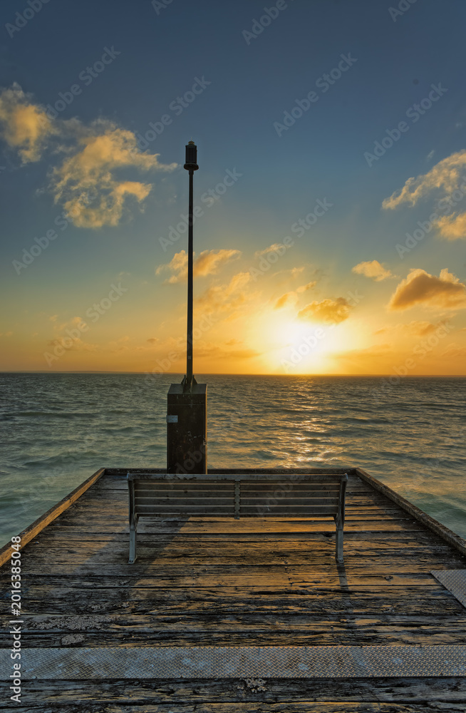 Fototapeta premium Sunset Over the Ocean at Ceduna Pier in Australia