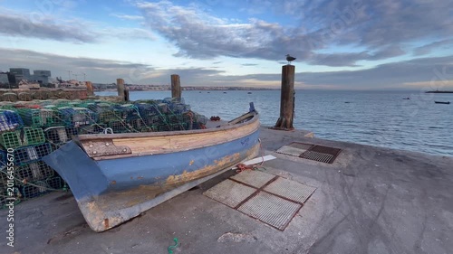 Traditional fishing boat in a pier in Cascais Portugal