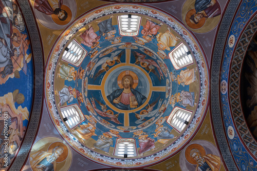 фотографія Upward view of the painted dome with Orthodox Christian frescoes and icons inside the Church of St