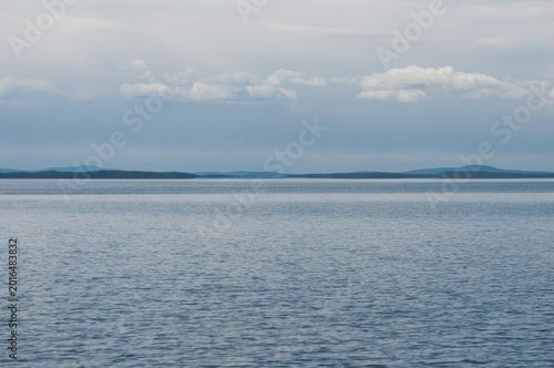 Scenery of forested islands in the wilderness of the lake Inari, Lapland, Finland in summer