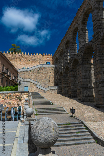 Photographs of the Segovia Aqueduct capturing its Roman majesty, historic architecture, and urban landscapes beneath a deep blue sky.