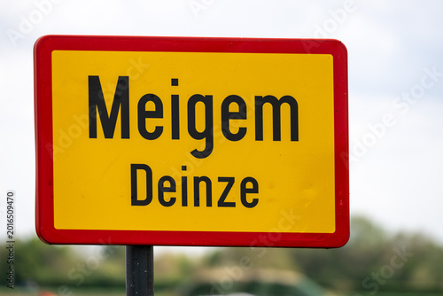 Yellow and orange place sign of Meigem
