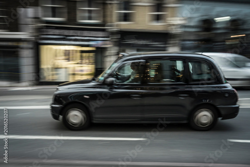 Moving Taxi on a street of London.