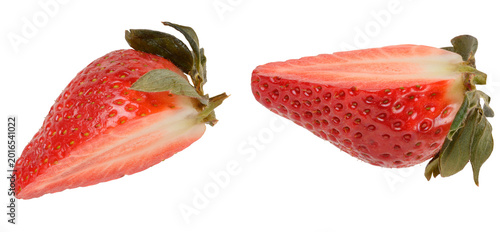 Photos Halves of red ripe strawberries with green sepals on isolated background