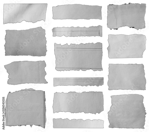Torn pieces of paper on white