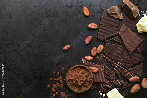 Ingredients for making hot chocolate on a black  background. Top view with copy space.
