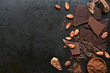 Ingredients for making hot chocolate on a black  background. Top view with copy space.