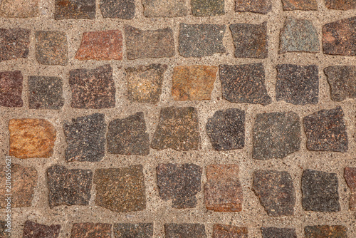 Cobblestone street pavement texture, top view. Stone background for urban design, architecture, historical city streets and abstract surface patterns.