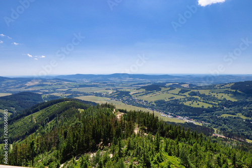Canvas-taulu Panoramic mountain ridge view over green valleys and farmland; Dolni Morava, Sud