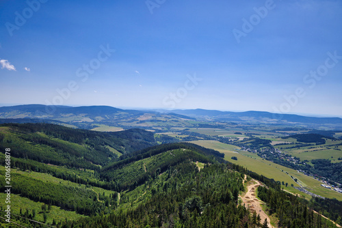 Photos Panoramic mountain and forest valley landscape under blue sky; Dolni Morava, Sud
