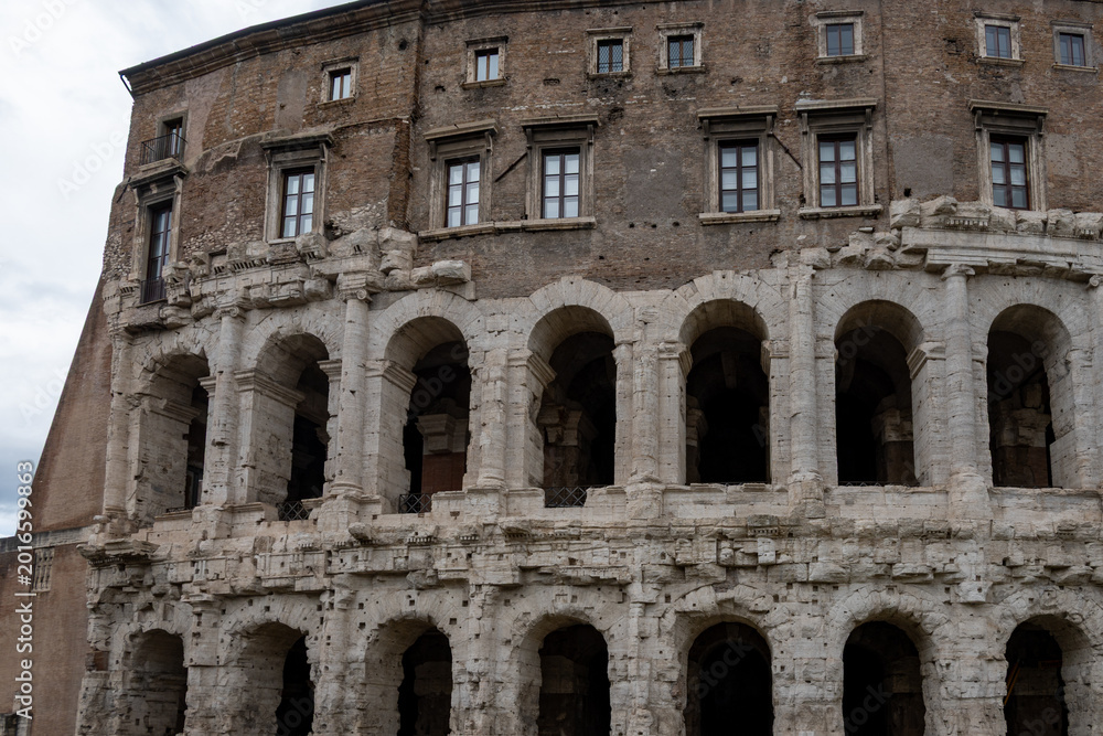 Obraz premium Architectural history in details of ruins, old buildings, walls, amfitheatres, arches in old part of Rome, dated from 300 BC, guided tours in Rome, Italy