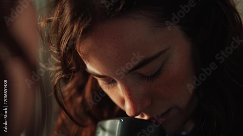 Close up of woman crying during conversation with another person in moment of intense emotion and vulnerability