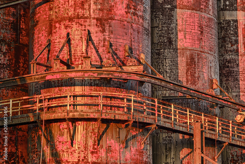 A Catwalk wraps around the various rusting and peeling storage tanks at sunset at the Bethlehem Steelworks in Pennsylvania