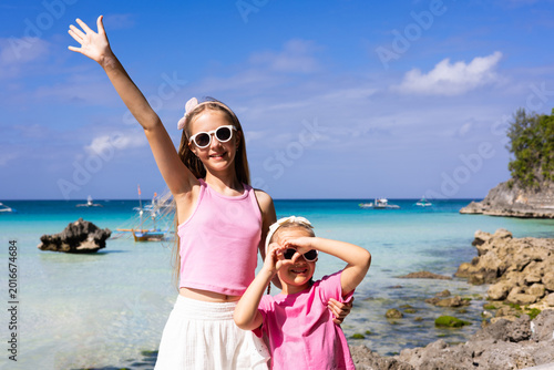 Sisters enjoying a sunny day at a tropical beach