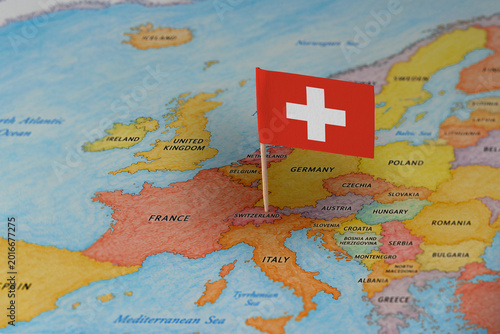 Fotografía Switzerland flag pin marking Switzerland on Europe map, travel destination conce