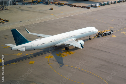 Fotografie Tow truck push back untitled airplane aerial view plane