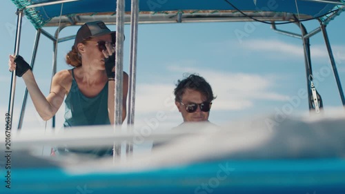 Couple sailing in the tropical calm sea during nice sunny day