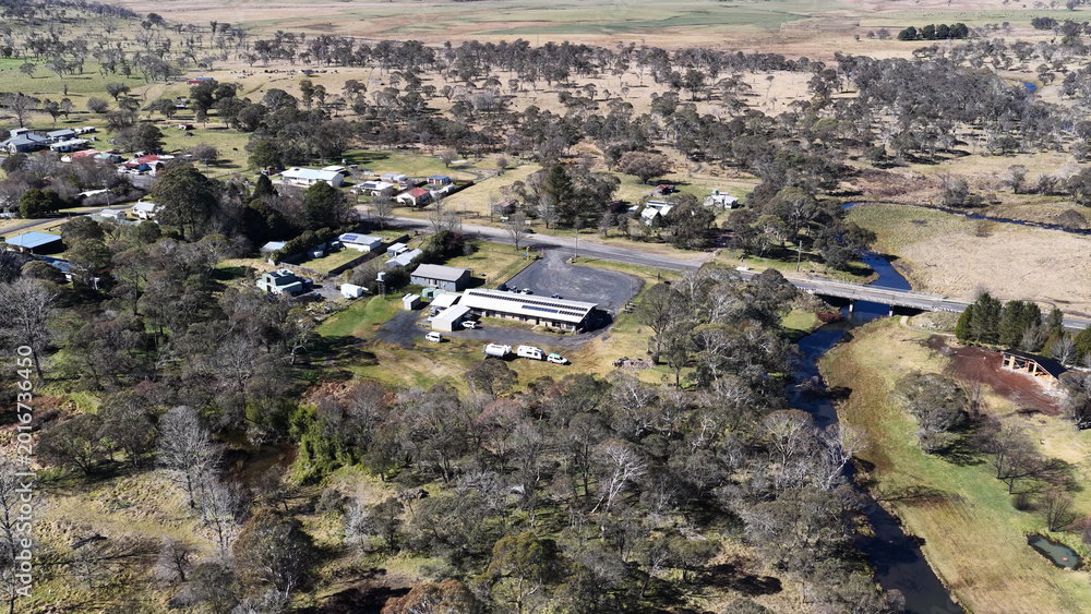 Naklejka premium Aerial View of a Small Rural Town and Creek in New South Wales